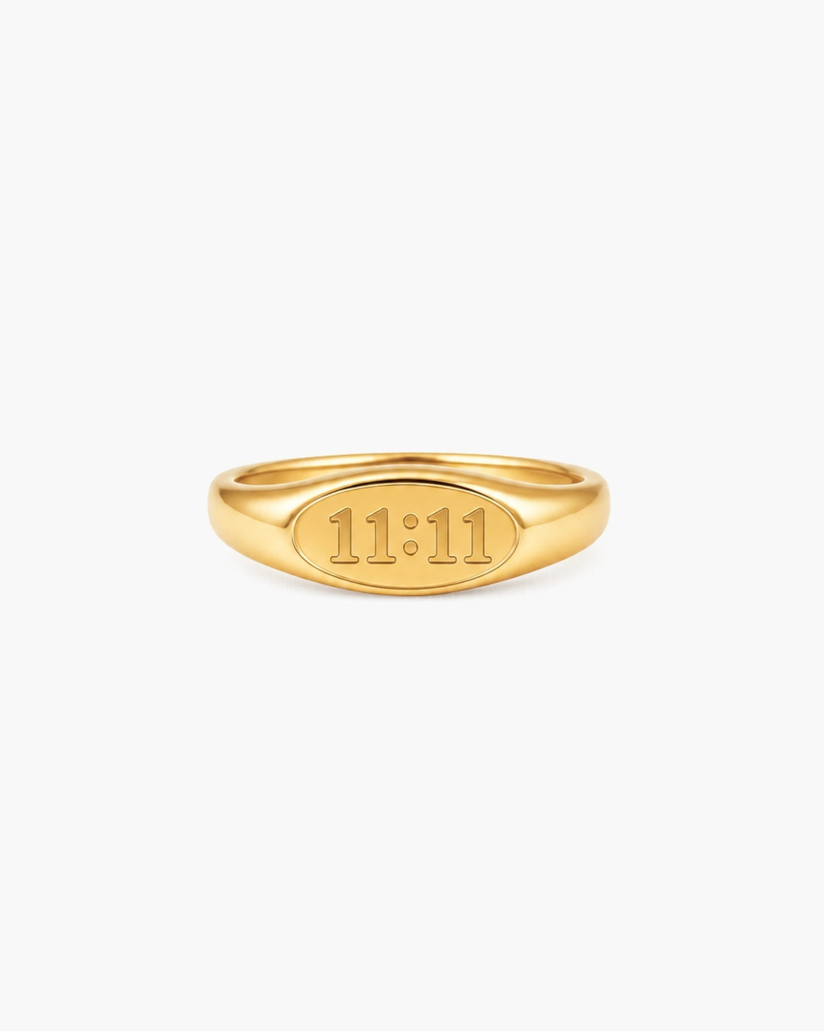 Polished gold-tone signet ring engraved with “11:11” on a white background.