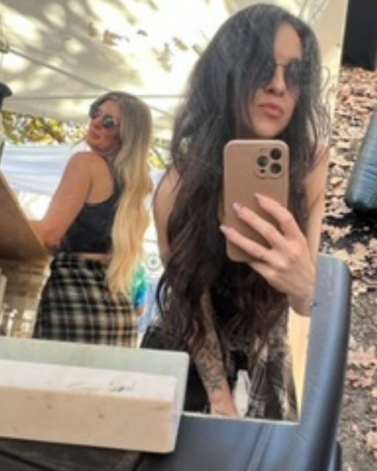 The KYELLA founders taking a mirror photo