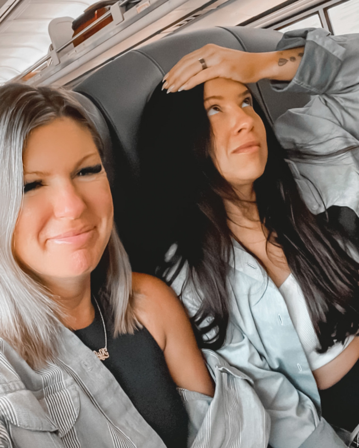 The KYELLA founders taking a selfie together in a car