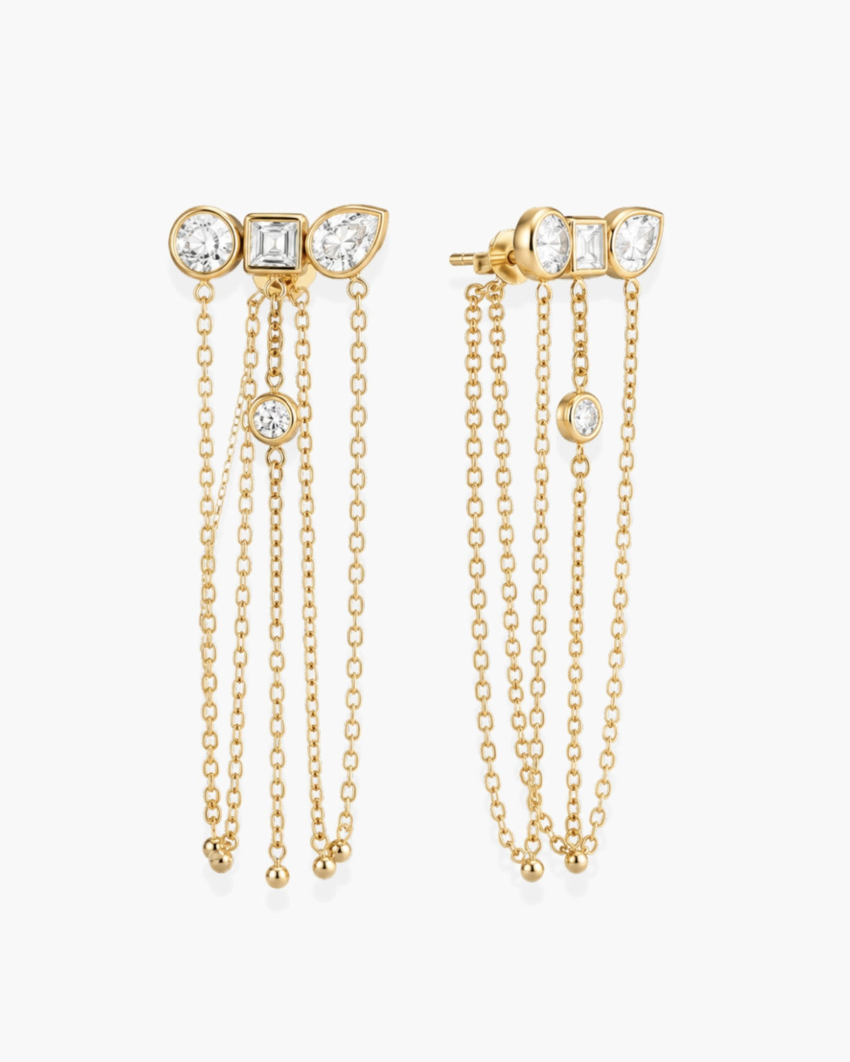 Pair of gold-tone Ariadne earrings with mixed-shape clear stones and cascading chain tassels.
