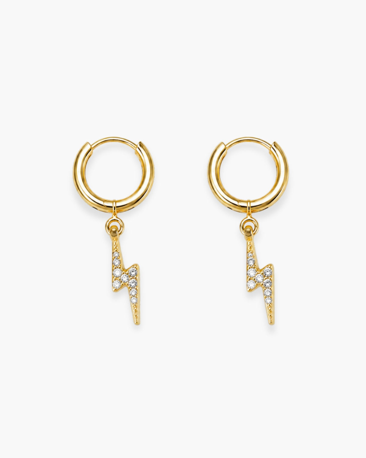 Pair of polished gold-tone huggie earrings with clear stone lightning bolt charms on a white background.