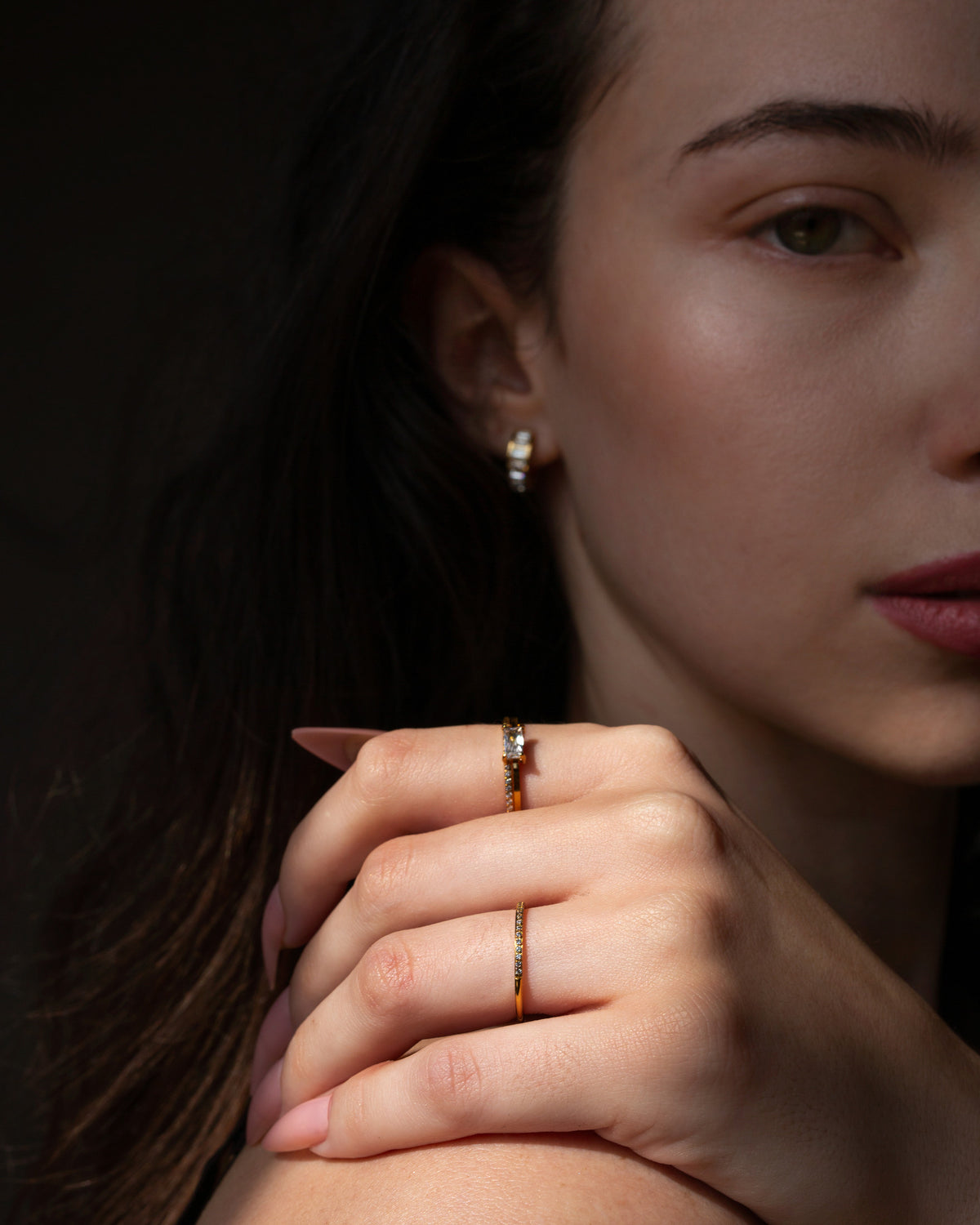 Aura gold pavé stacking ring worn in a close fashion portrait.