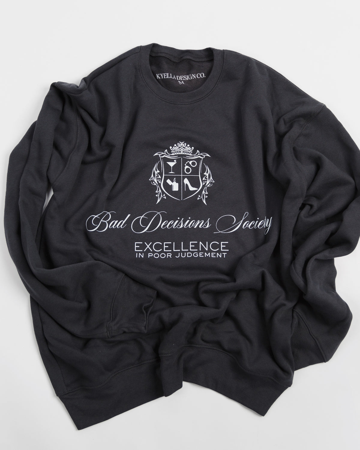 Detail view of the Bad Decisions Society black crewneck sweatshirt.
