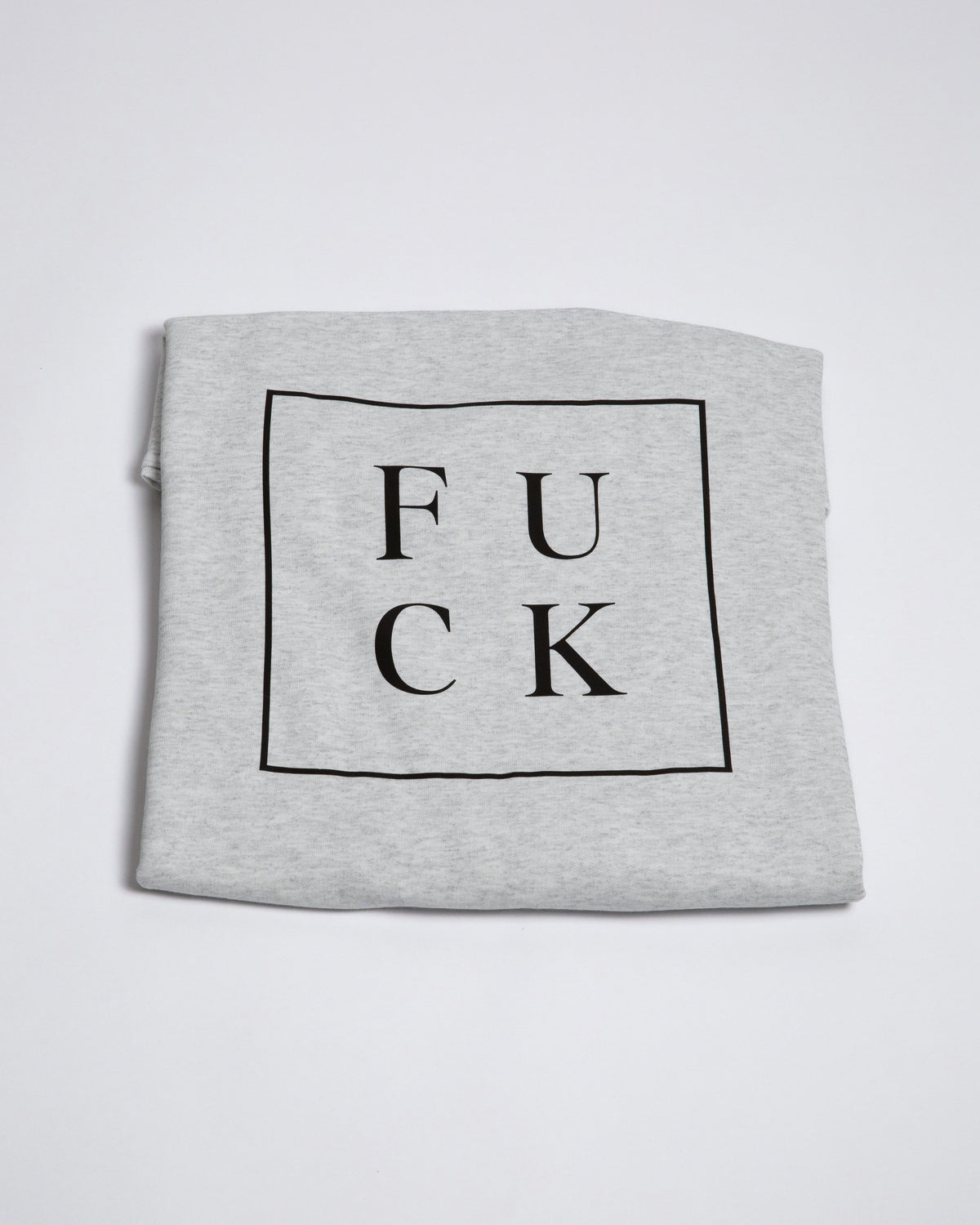 Heather-gray crewneck showing the boxed F U C K back graphic.