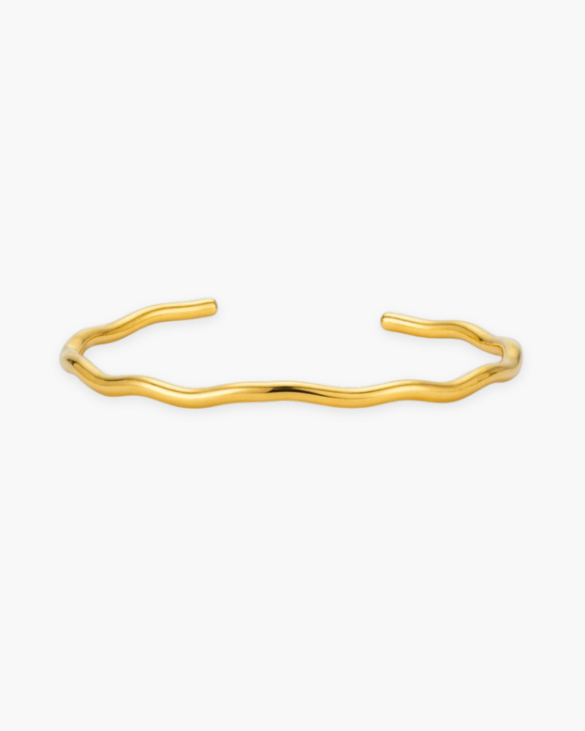 Calypso Cuff, a fluid wave-shaped 18K Gold PVD open cuff bracelet.