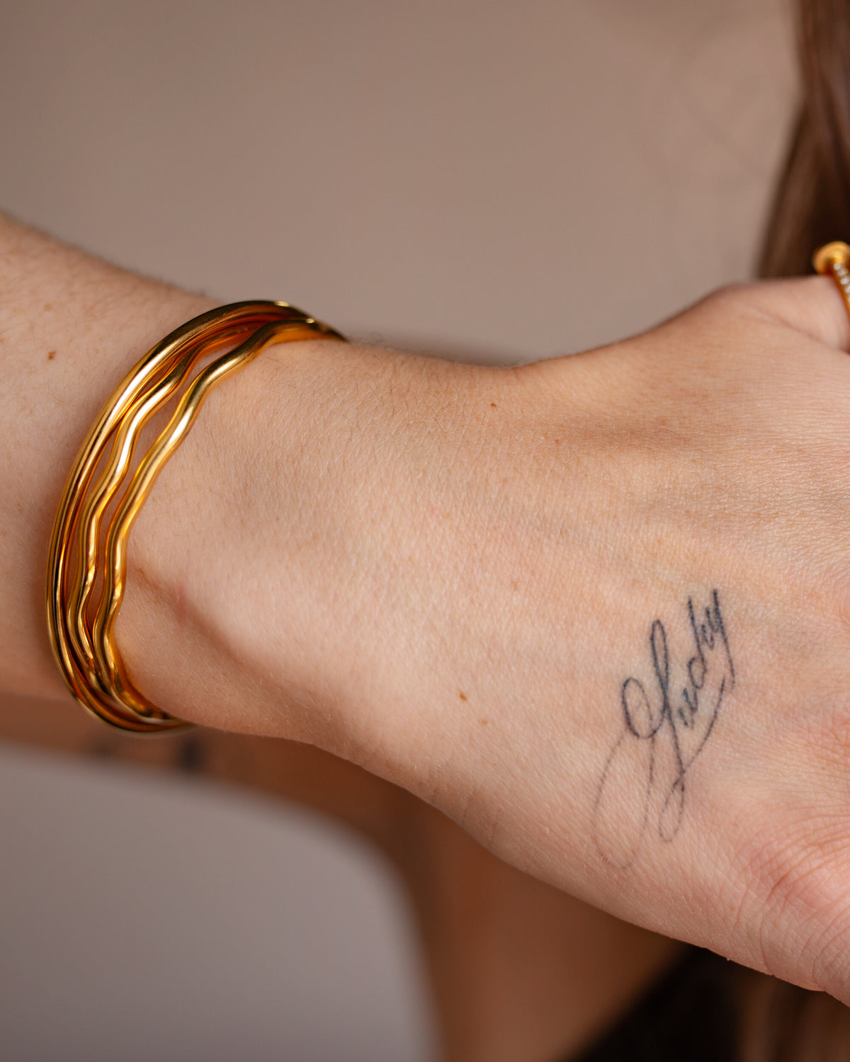 Calypso Cuff worn on the wrist, hover view.