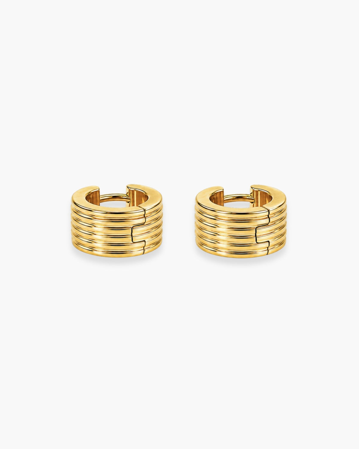 Pair of wide gold-tone huggie hoop earrings with stacked horizontal ridges.