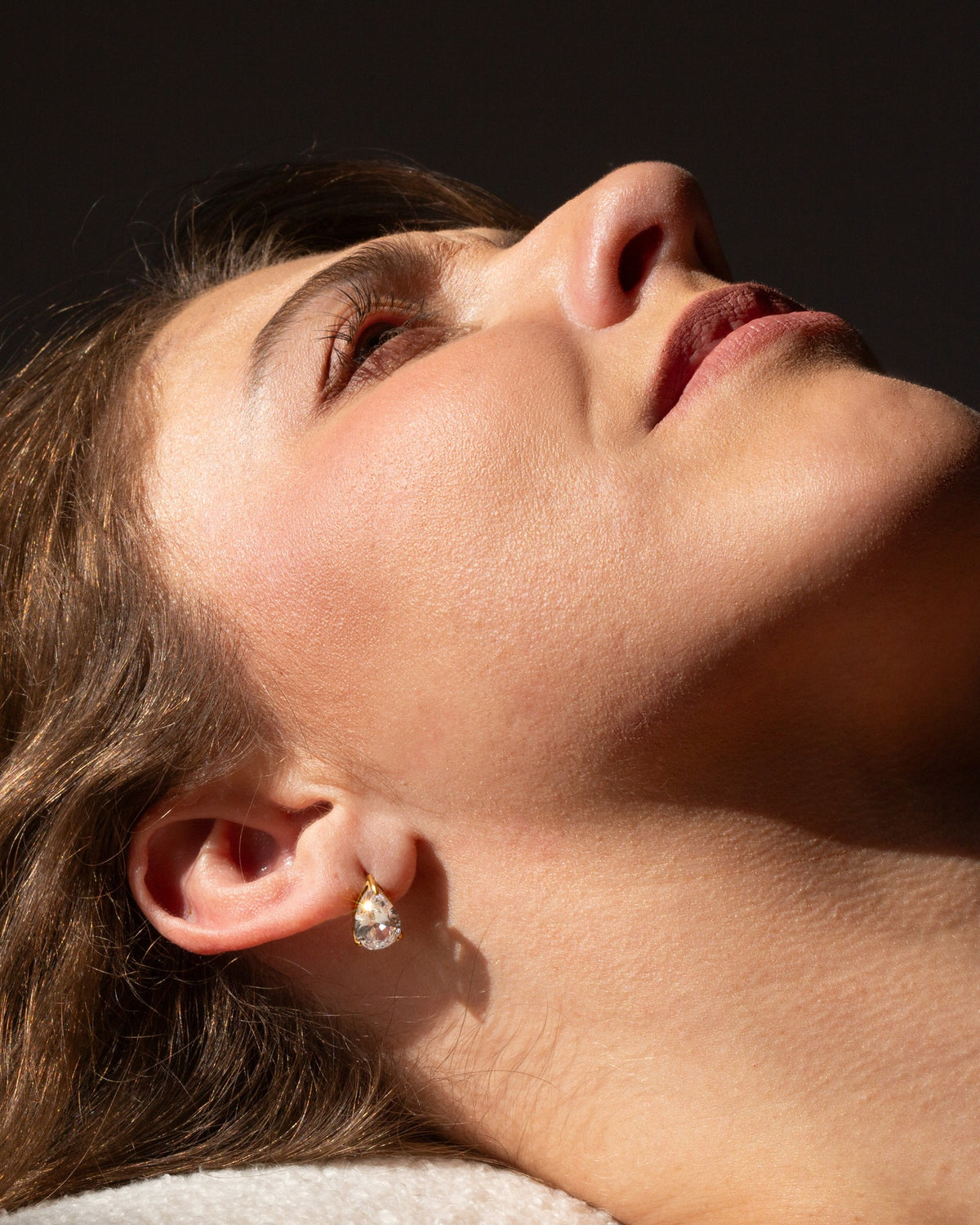 Georgia teardrop studs shown in a warm editorial portrait.