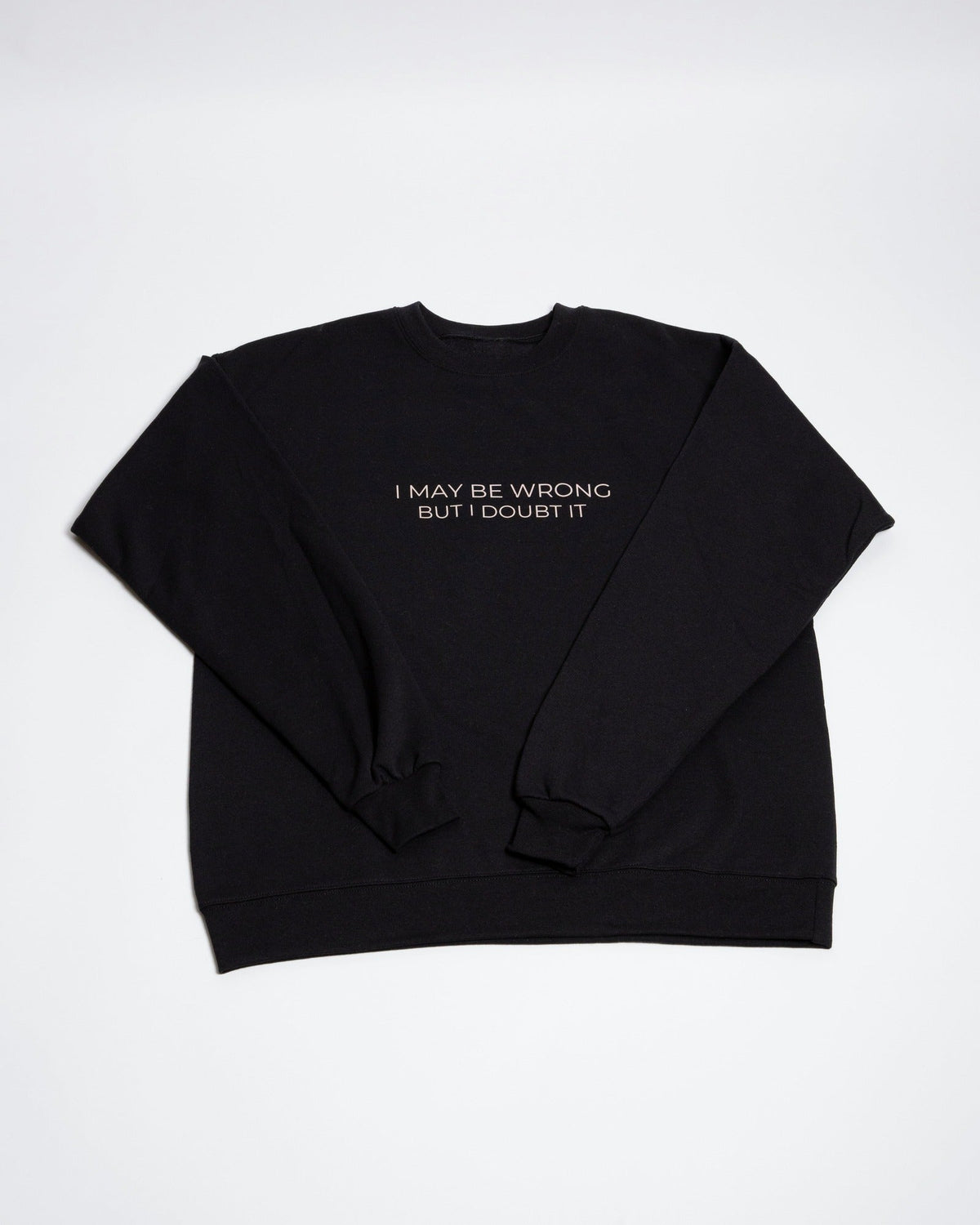 Black I May Be Wrong But I Doubt It crewneck sweatshirt laid flat.