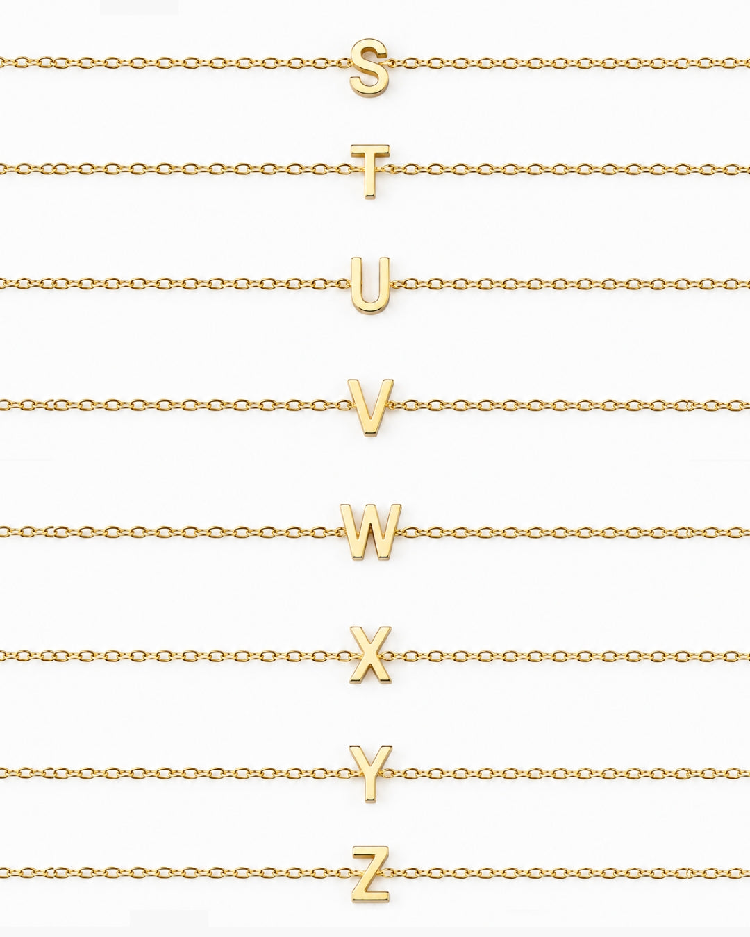 Initial Necklace letters S through Z arranged on gold chains on a white background.