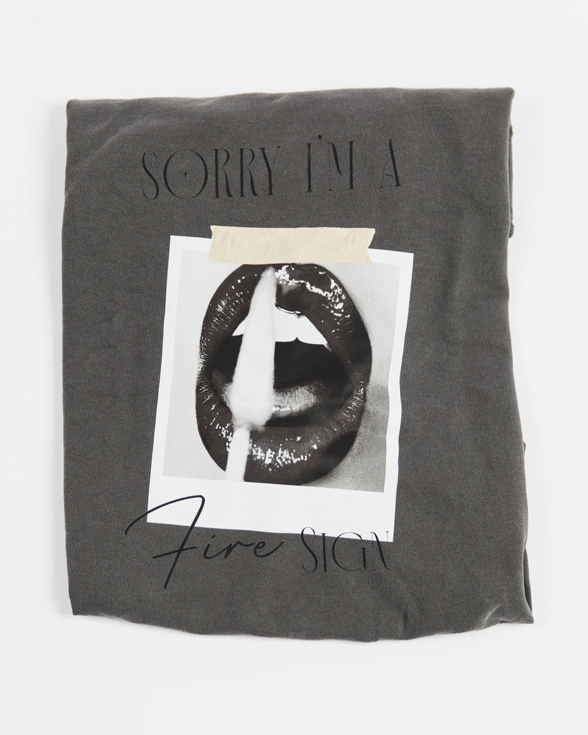 Folded washed charcoal Sorry I’m a Fire Sign crewneck sweatshirt.