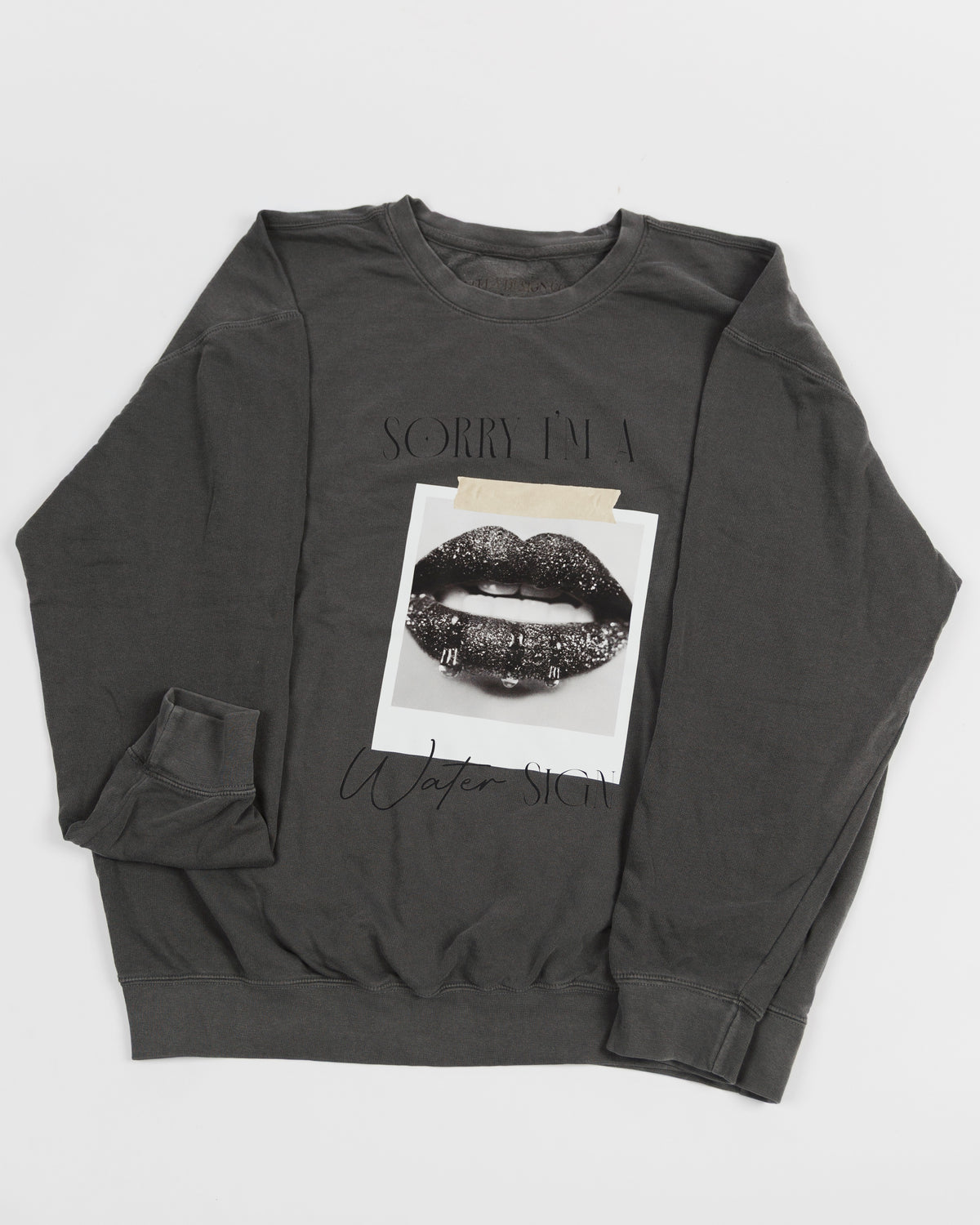 Washed charcoal Sorry I’m a Water Sign crewneck sweatshirt laid flat.