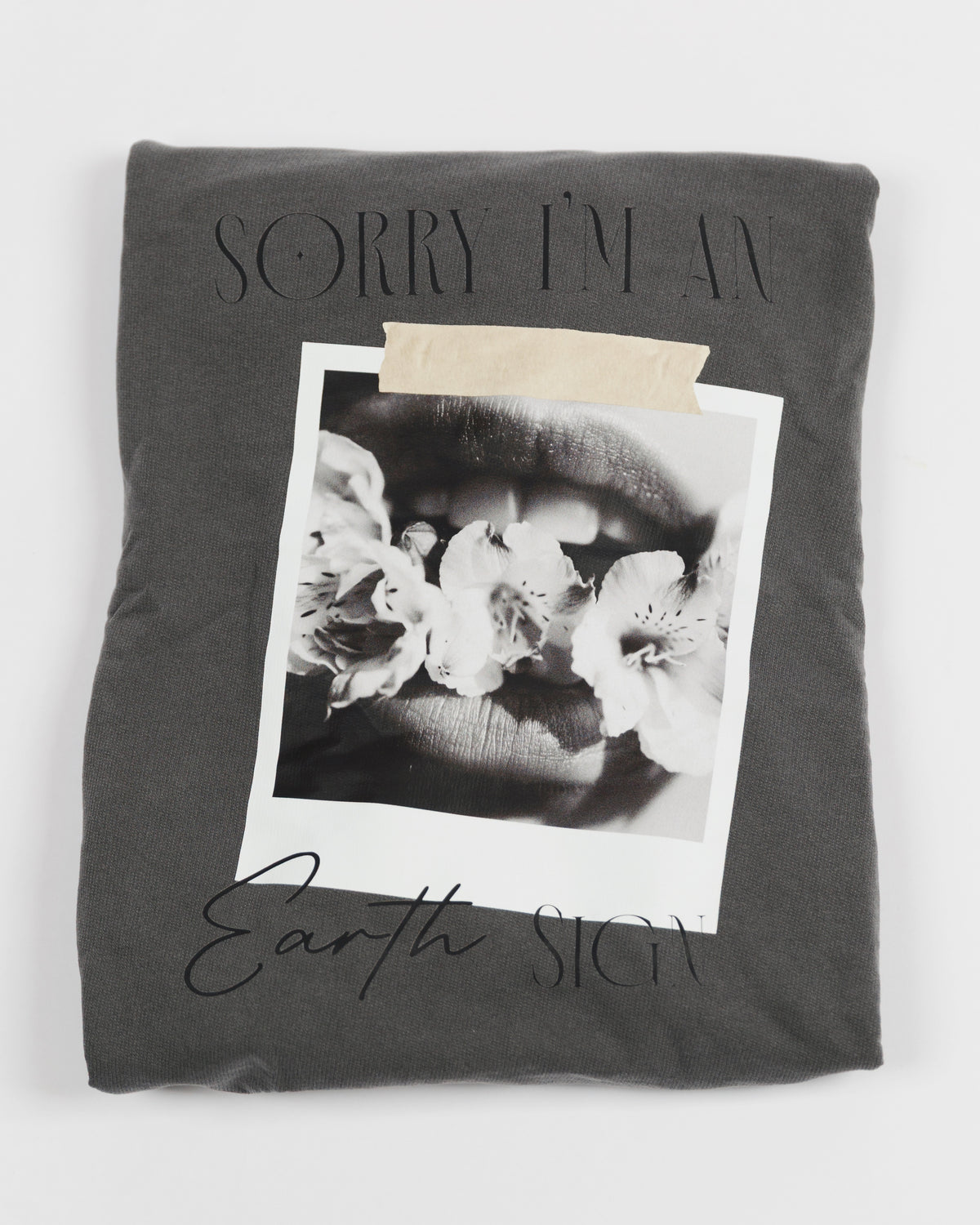Folded washed charcoal Sorry I’m an Earth Sign crewneck sweatshirt.