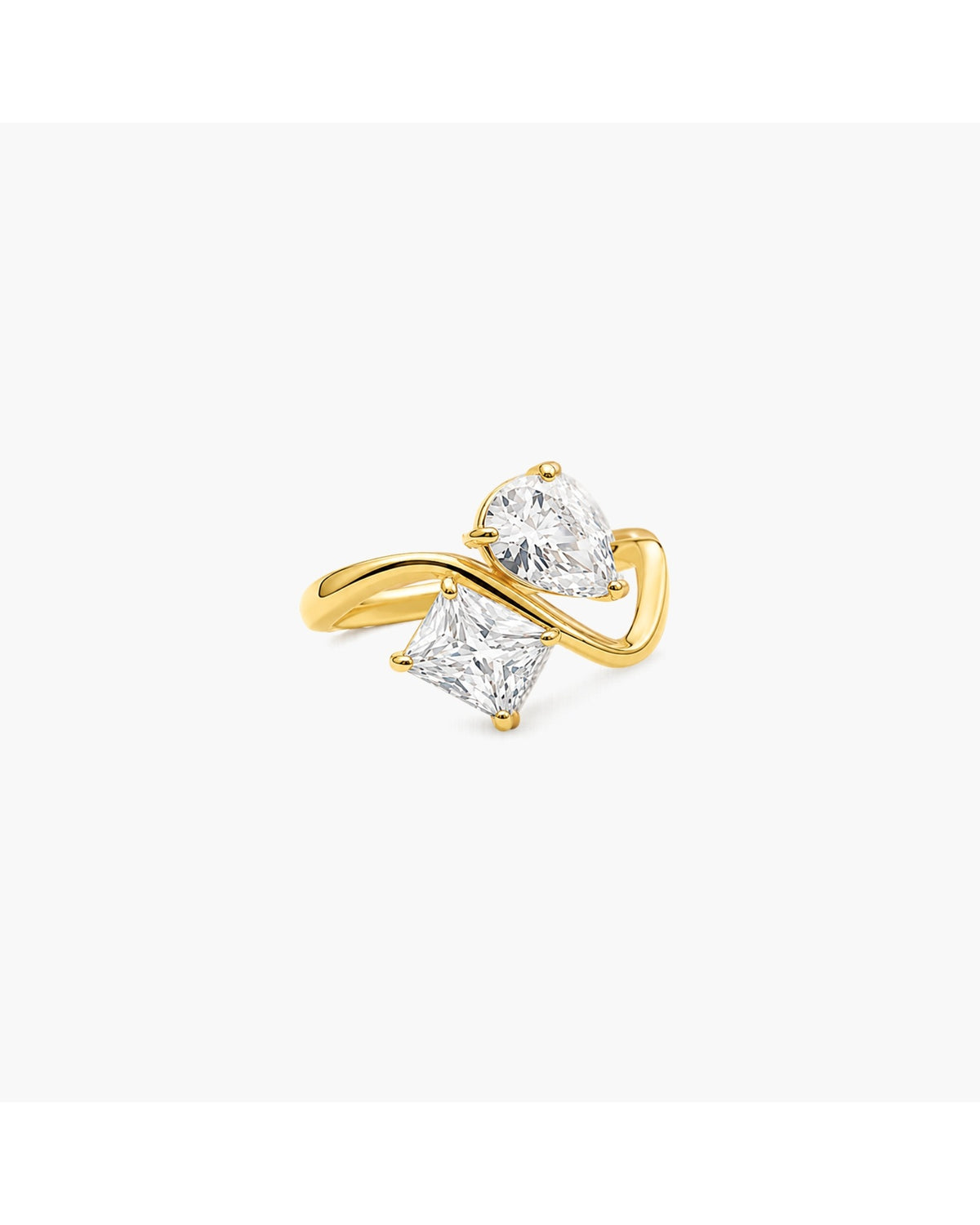 Gold-tone Talia crossover ring with one clear pear-shaped stone and one clear kite-shaped stone on a white background.