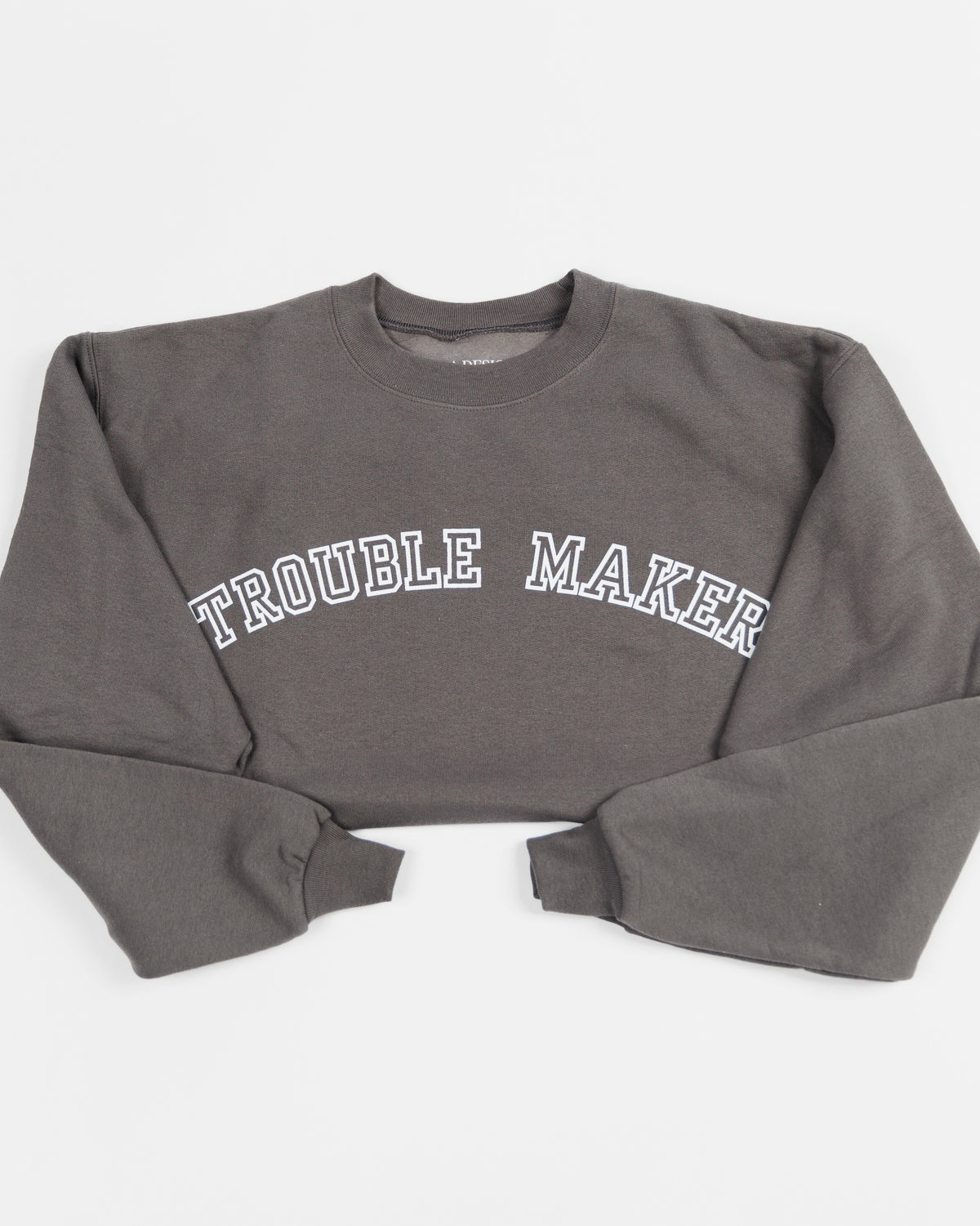 Charcoal Trouble Maker crewneck sweatshirt worn by a model.