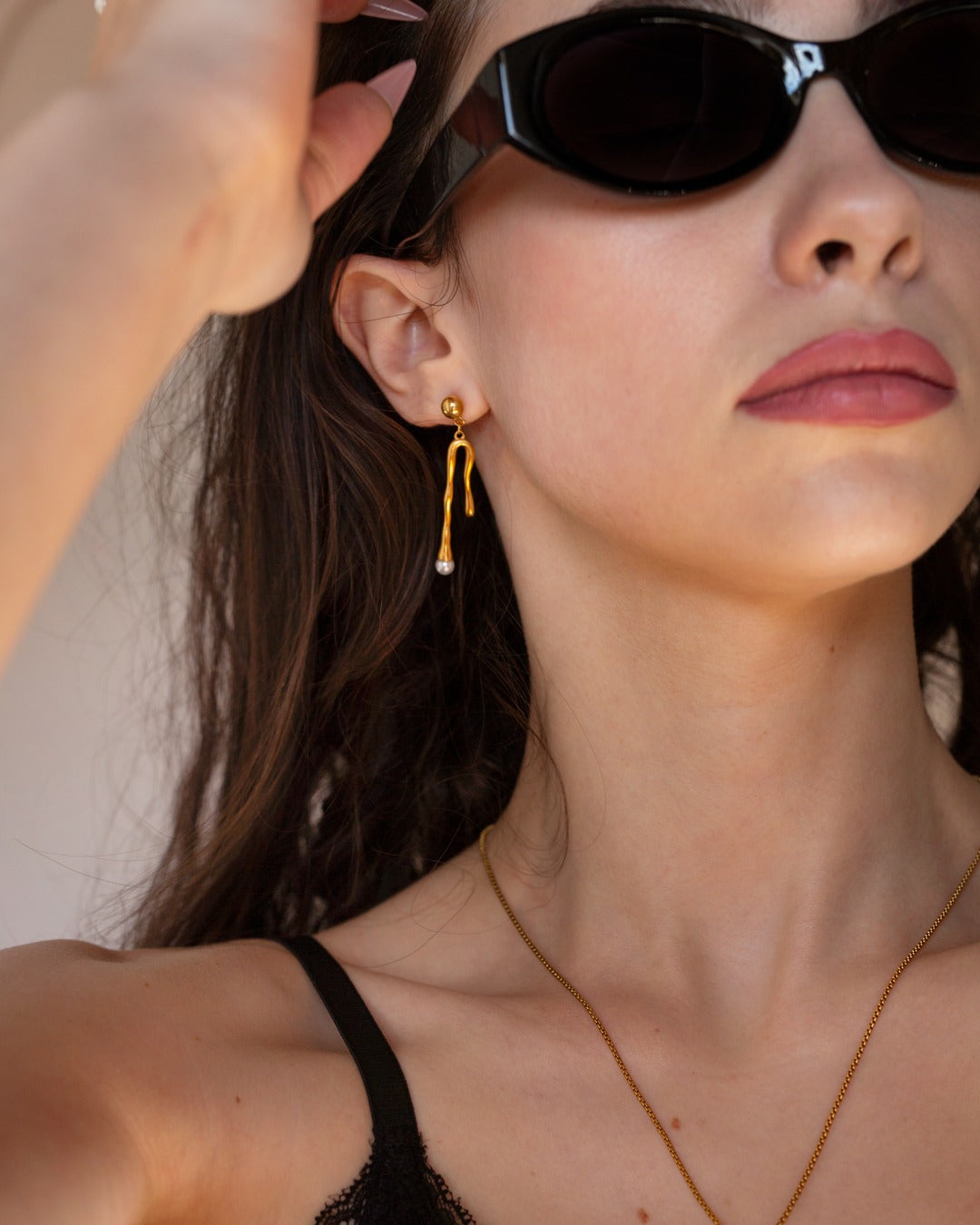 Zenobia Necklace worn in a sunglasses lifestyle view.