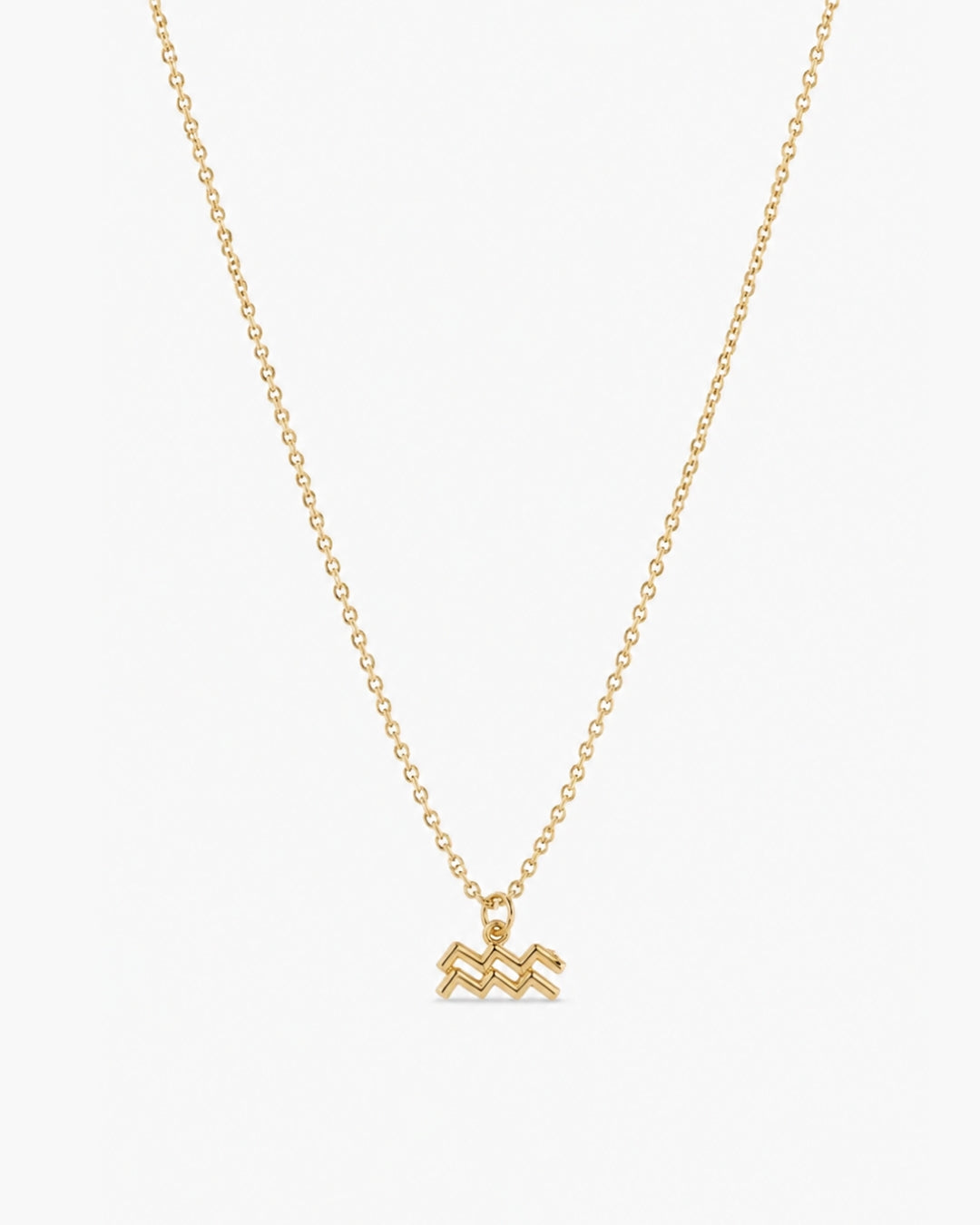 Gold-tone Aquarius zodiac pendant necklace on a fine adjustable chain.