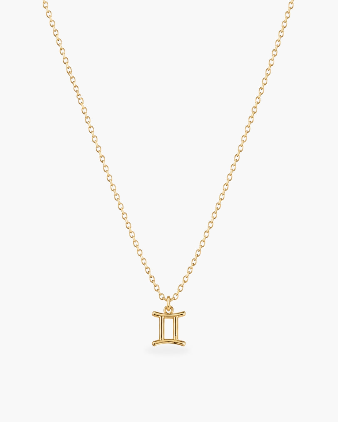 Gold-tone Gemini zodiac pendant necklace on a fine adjustable chain.